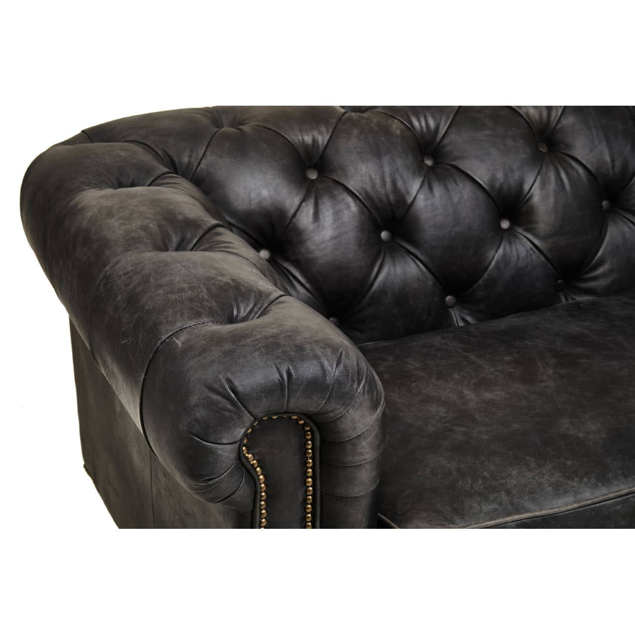Close-up view of the armrest and tufted back of a Hoxton Antique Black 3 Seat Chesterfield Leather Sofa, showcasing the rich, textured black leather and decorative buttons. The sofa features a classic design with a curved arm and visible stitching details
