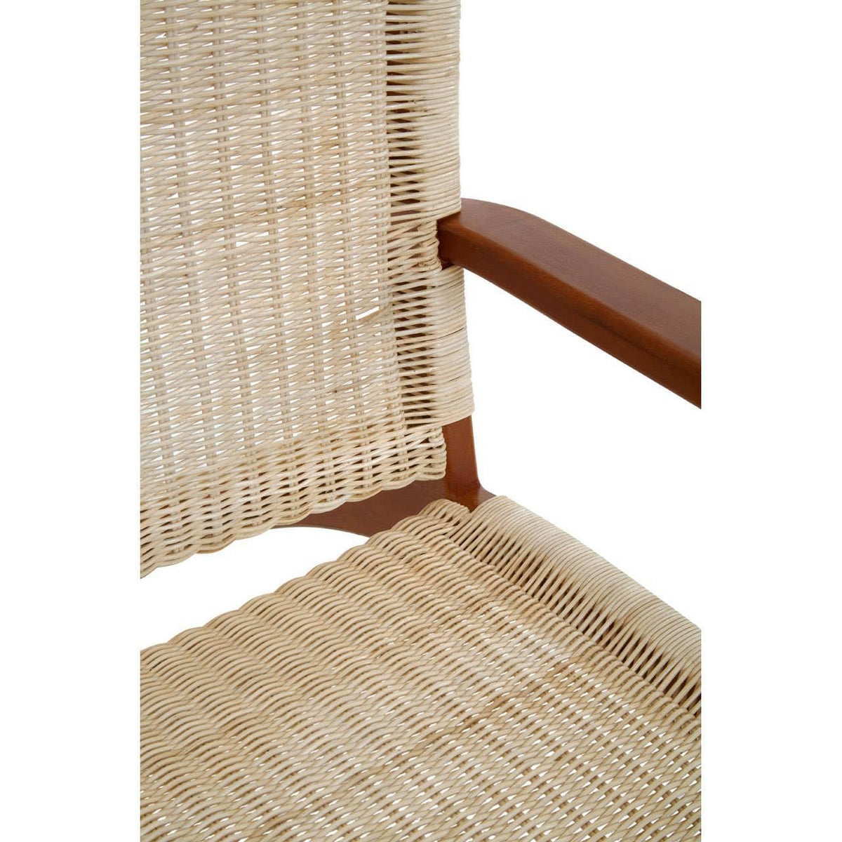 Close-up of woven rattan chair seat and backrest with wooden armrest