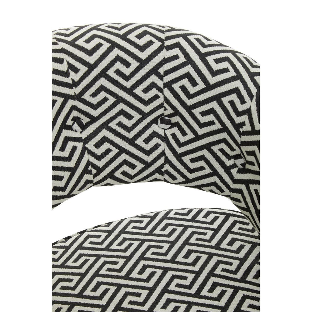 Close-up of patterned fabric dining chair backrest with black and white geometric design