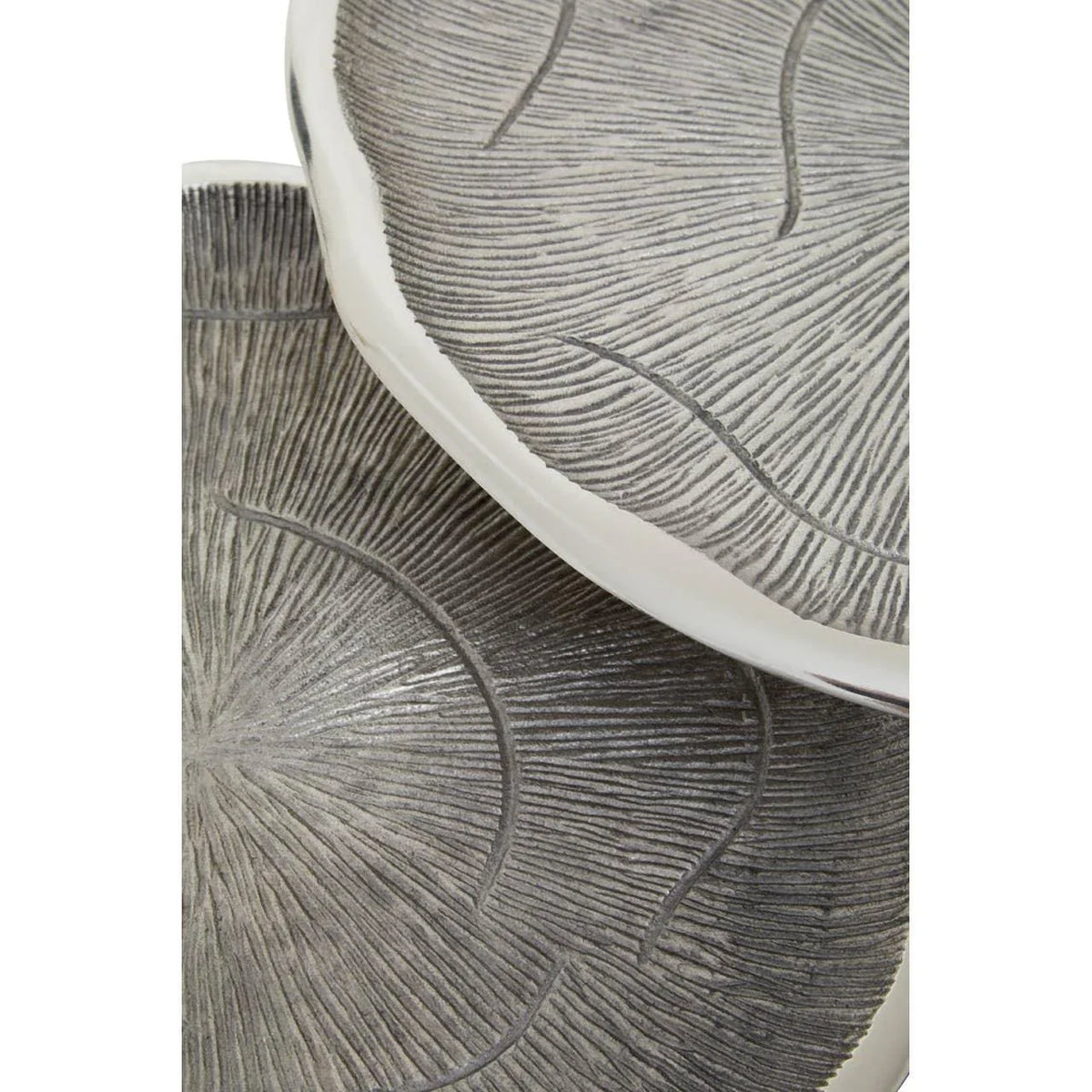 Round decorative trays with textured grey surface and raised edges, stacked together