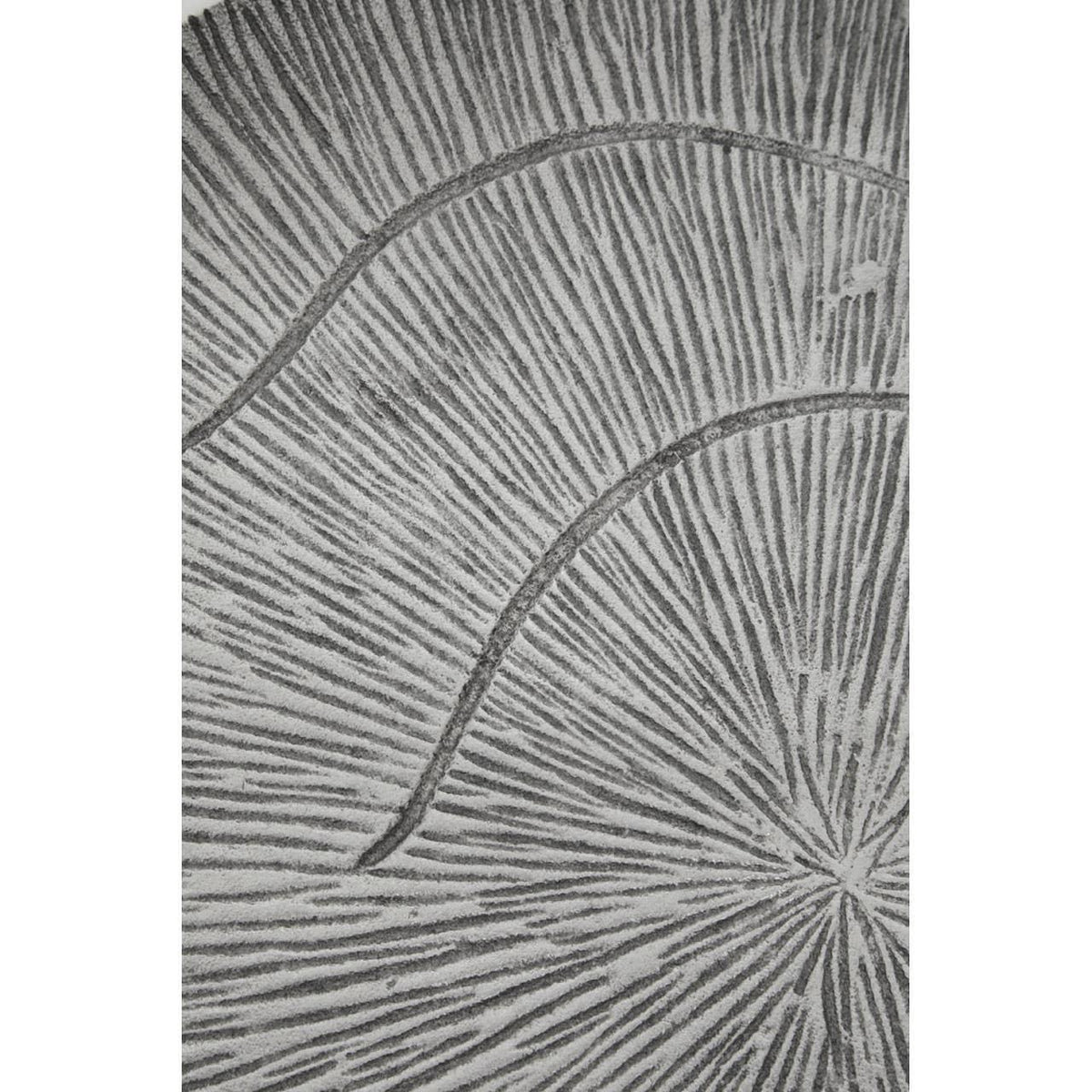Grey patterned rug closeup showing textured sunburst design and raised linear details