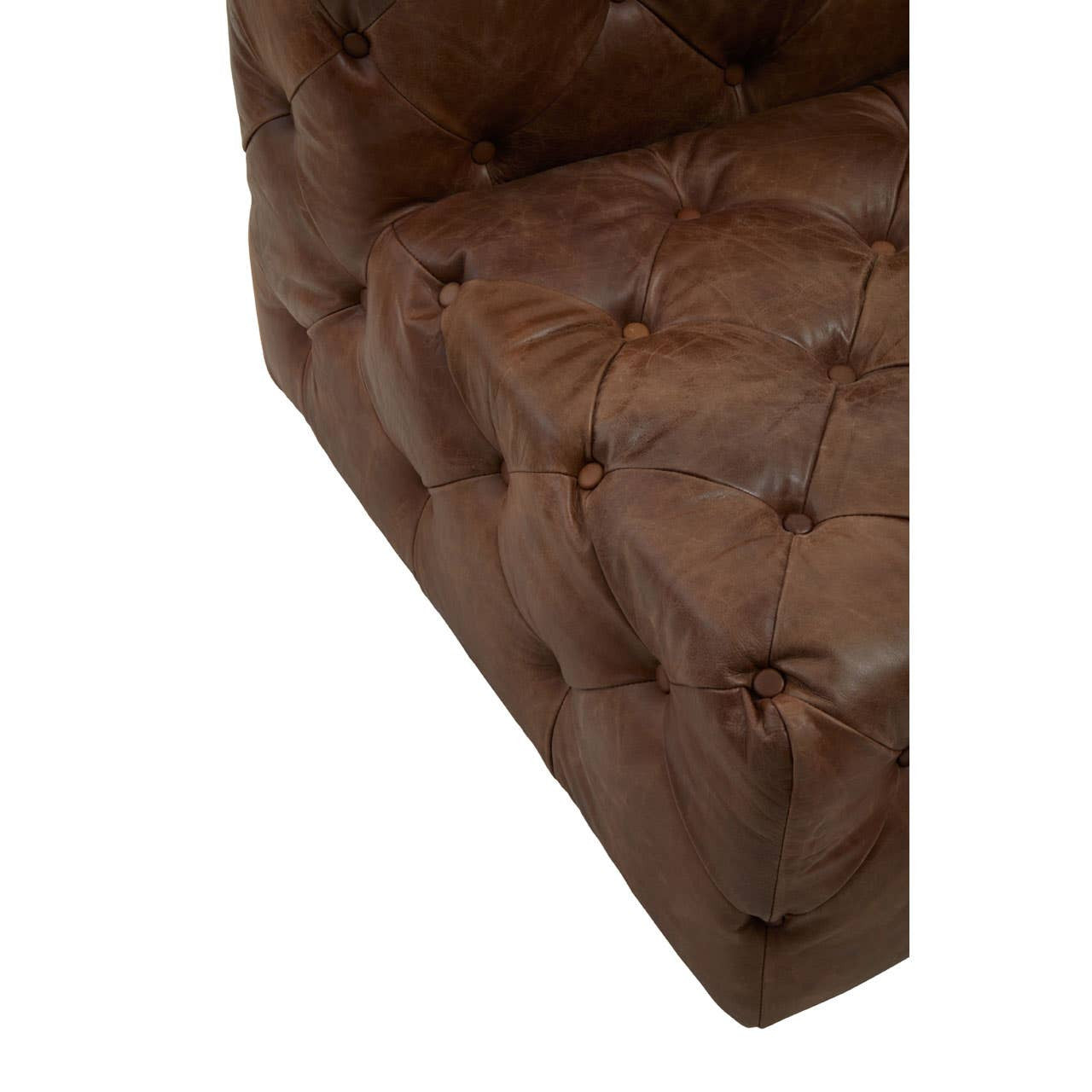 Close-up view of a brown leather modular sofa chair featuring a tufted design with visible buttons and a sleek, modern silhouette. The corner of the chair shows the rich texture of the leather and the craftsmanship of the stitching