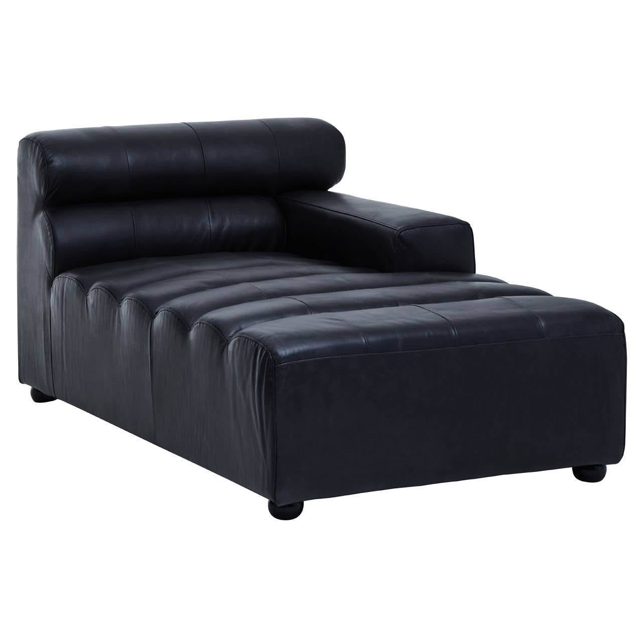 A right arm modular chaise sofa in antique black leather, featuring a low backrest with three horizontal cushions and a sleek, modern design. The sofa has a wide seat with horizontal stitching and rounded feet for stability