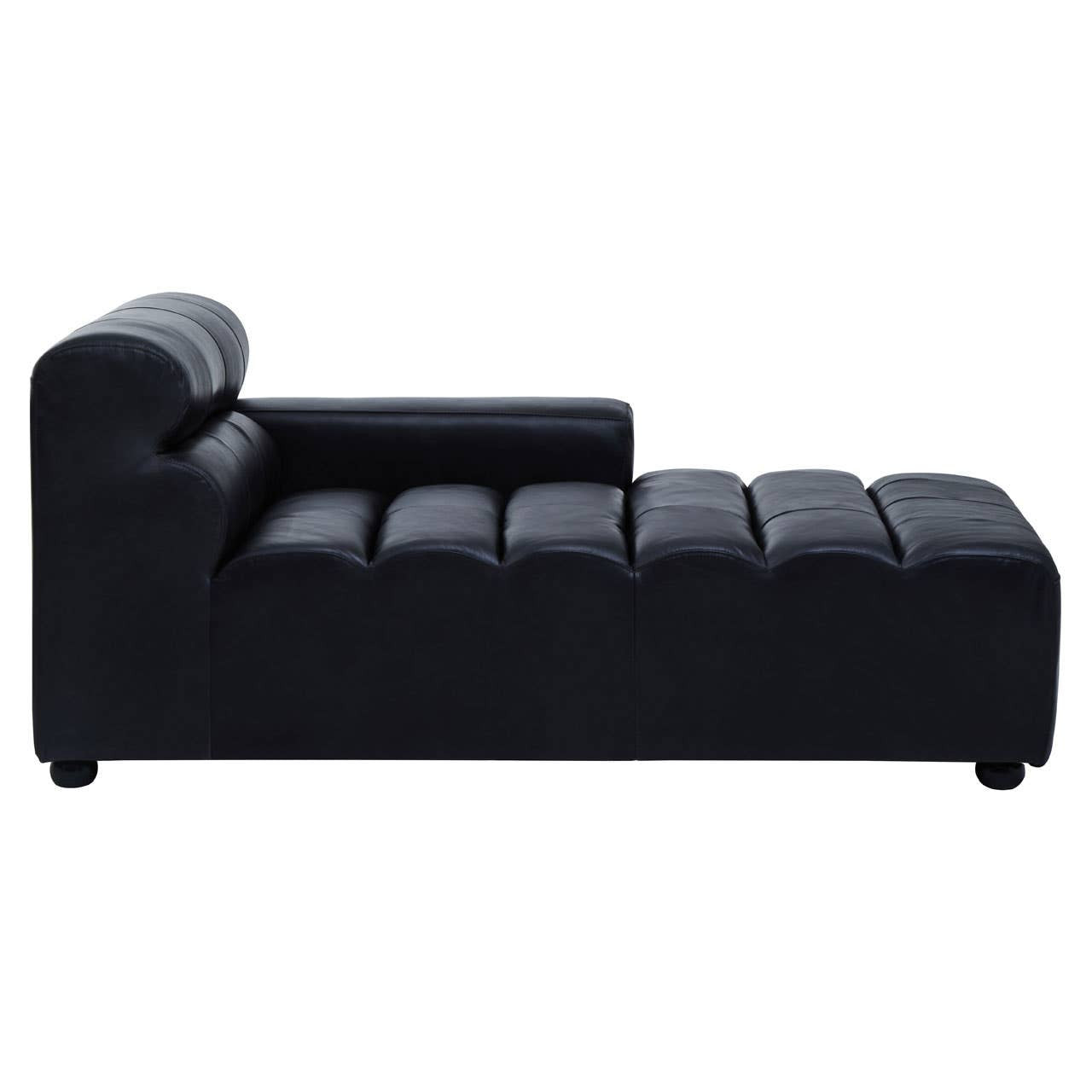 Right arm leather modular chaise sofa in antique black with a sleek design, featuring a tufted seat and a rounded backrest, resting on short legs
