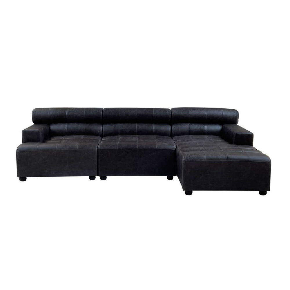 A modular chaise sofa in antique black leather featuring a right arm design. The sofa has a sleek, contemporary shape with plush cushions and a low backrest, providing a modern aesthetic suitable for various living spaces. The legs are short and sturdy, enhancing stability