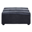 Antique black leather modular ottoman with a tufted top and rounded edges, featuring a sturdy base and small, round feet