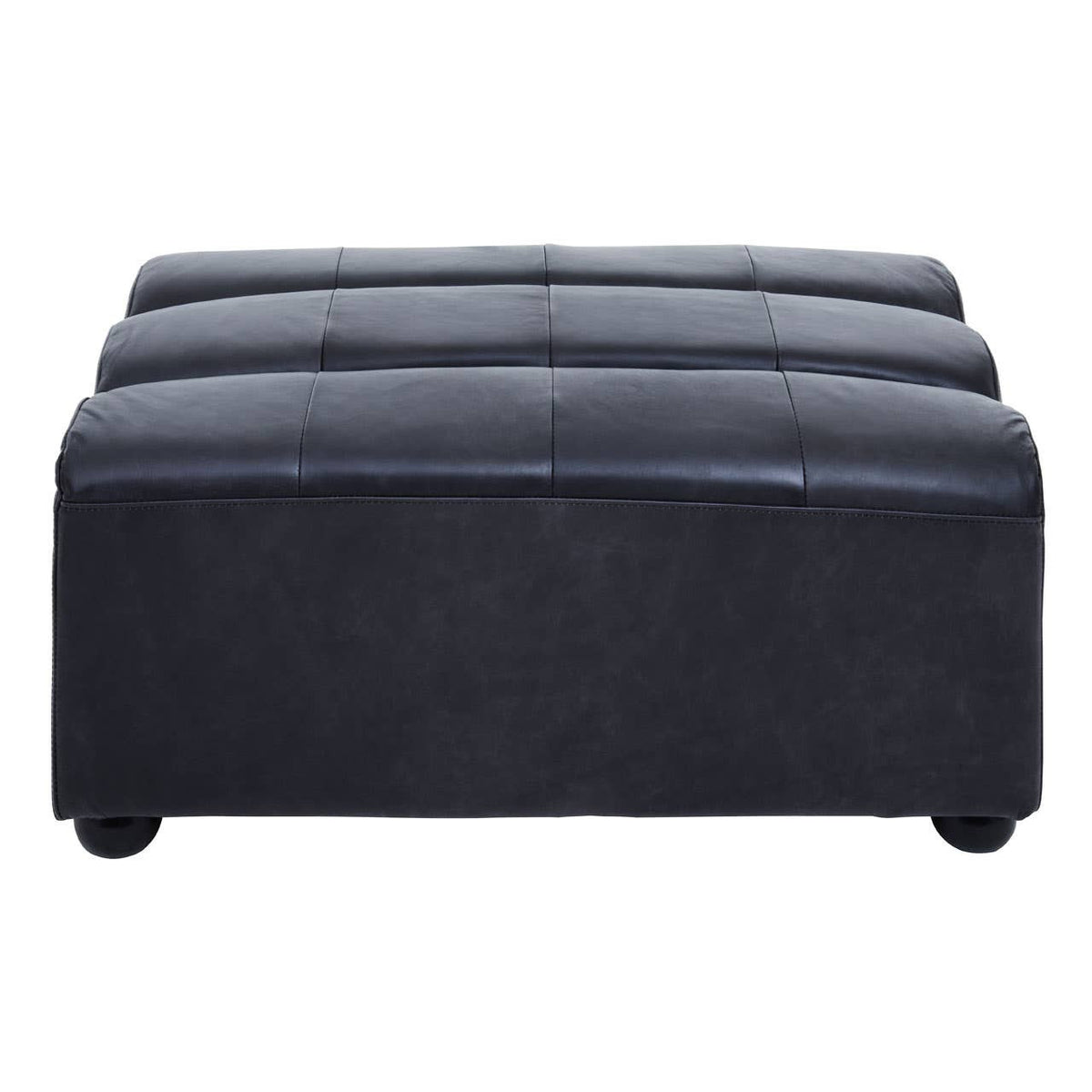 Antique black leather modular ottoman with a tufted top and rounded edges, featuring a sturdy base and small, round feet