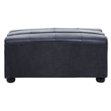 Antique black leather modular ottoman with a smooth, slightly curved top and tufted design, resting on rounded feet. The ottoman features a sleek, modern silhouette suitable for various home decor styles