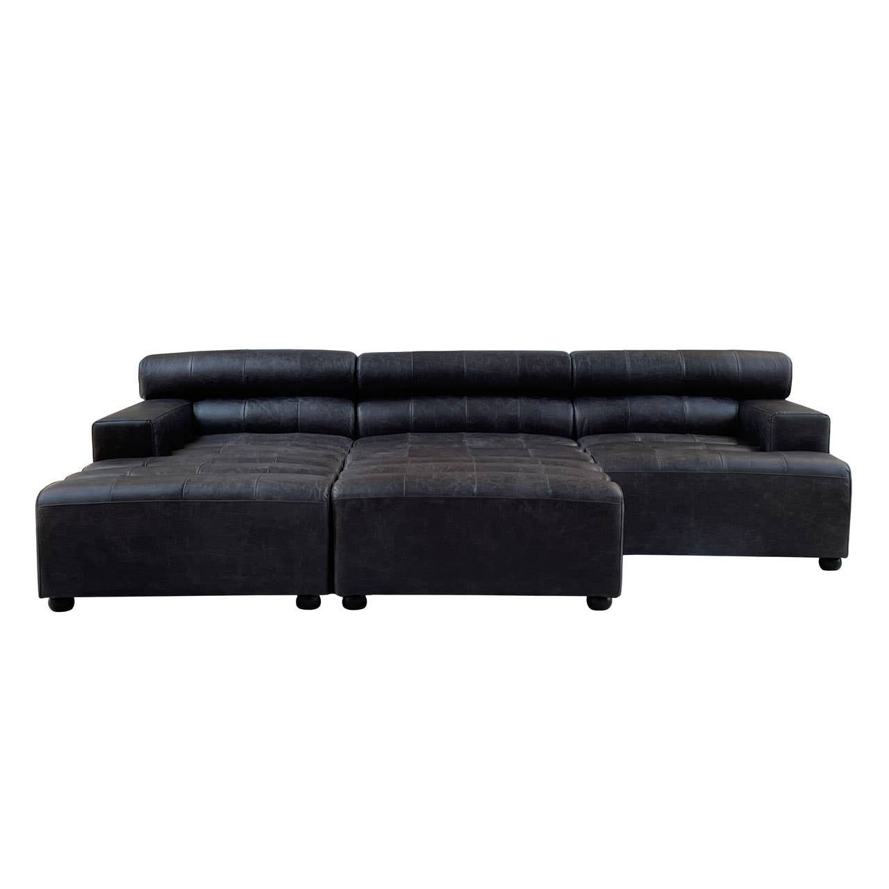 Black leather modular ottoman featuring a sleek, contemporary design with a low profile and rounded edges. The ottoman is divided into two sections, providing versatility in arrangement. The surface is smooth and polished, highlighting the rich texture of the leather