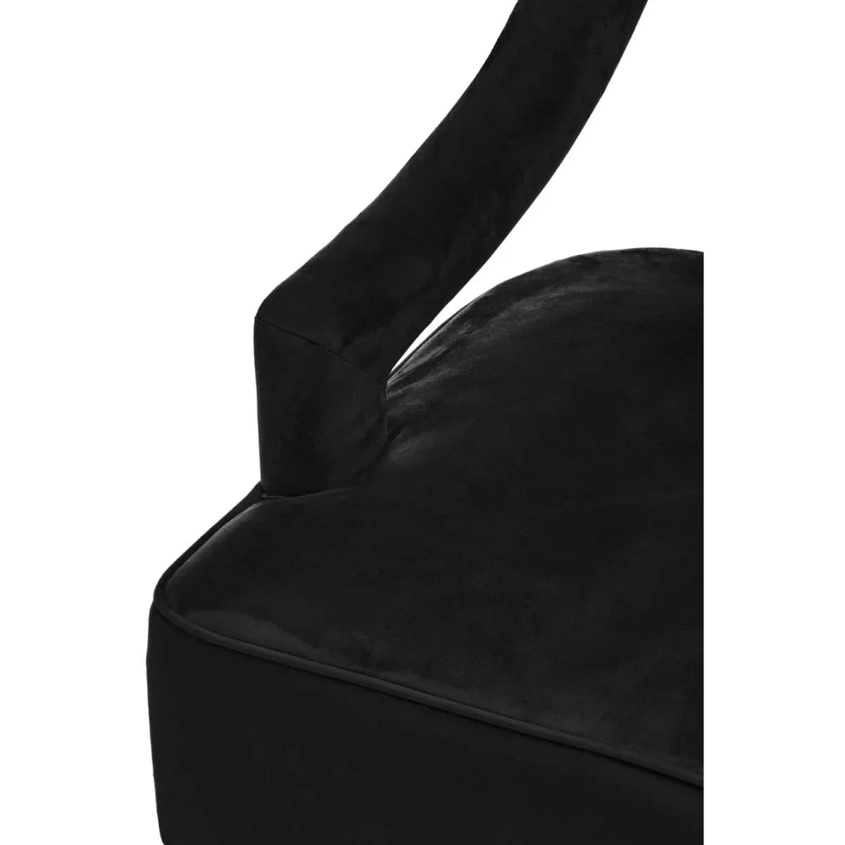 Close-up of black velvet chair armrest and cushion upholstery
