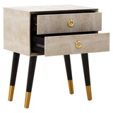 Beige bedside table with gold handles, two open drawers, and black legs with gold tips