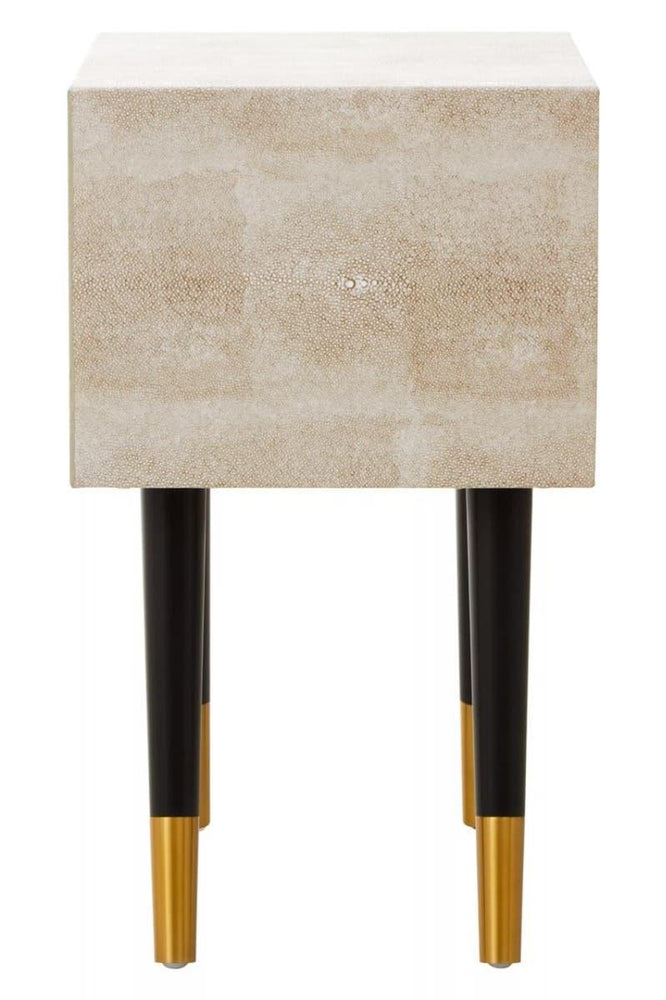 Textured beige bedside table with black legs and gold tips, front view