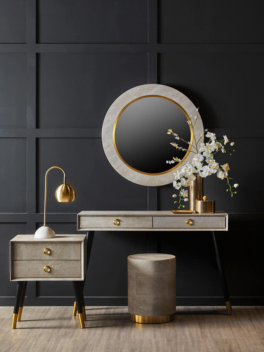 Modern dressing table set with gold accents, round mirror, side table and gold lamp