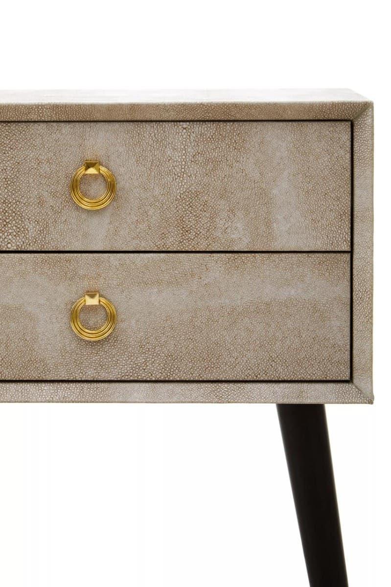 Textured two drawer bedside table with gold ring handles and angled dark legs