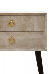 Textured two drawer bedside table with gold ring handles and angled dark legs