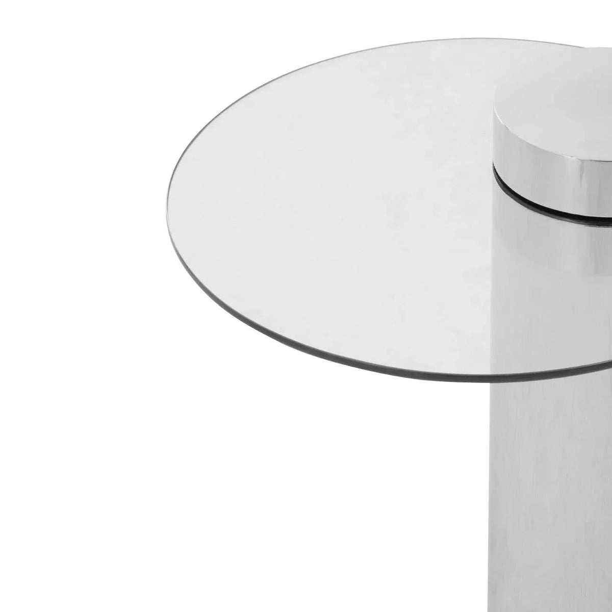Round glass side table with chrome pedestal base, close-up of tabletop and support