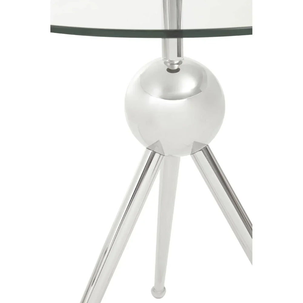Glass top side table with chrome tripod legs and spherical metal base closeup