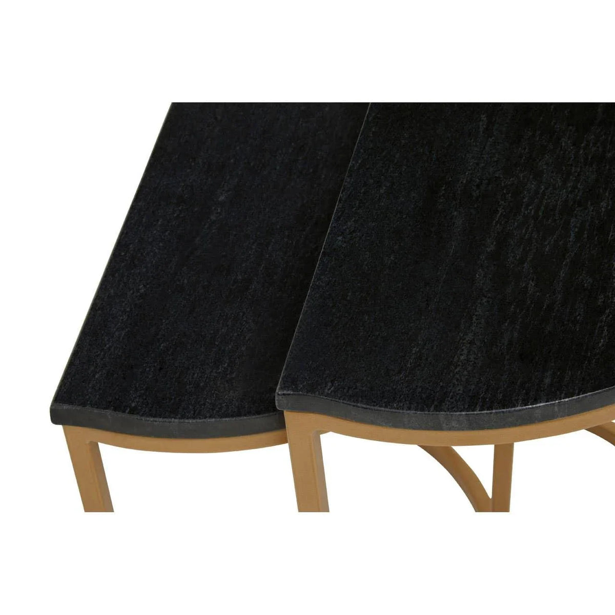 Black wooden nesting tables with gold legs, close-up on curved tabletop design
