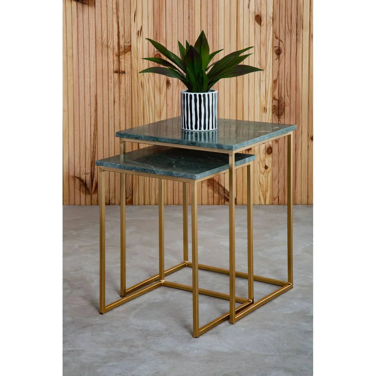Green marble nesting tables with gold metal frames, striped plant pot on top table