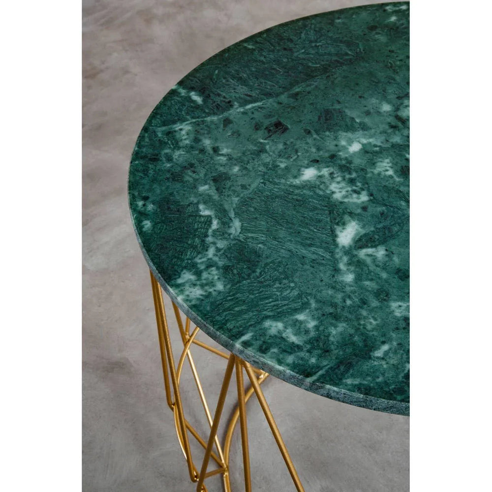 Round green marble table with gold metal legs, close-up of textured top and frame