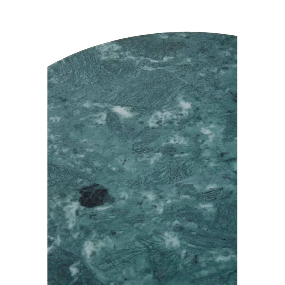 Green marble table top surface with natural veining, close-up detail