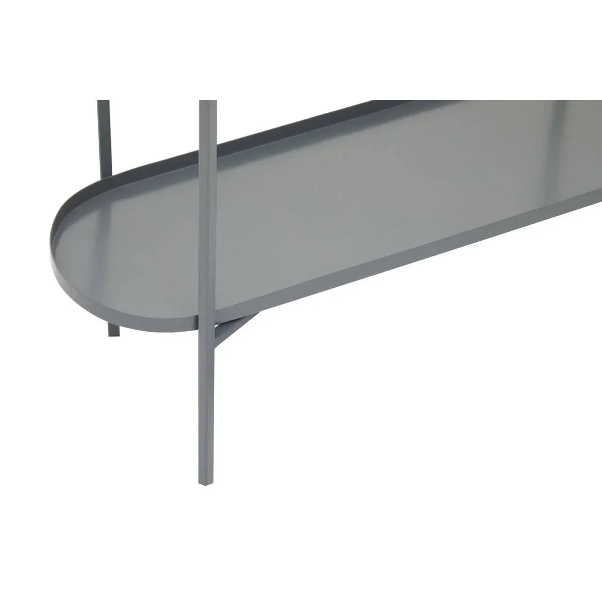 Close-up of grey metal console table lower shelf and slim legs