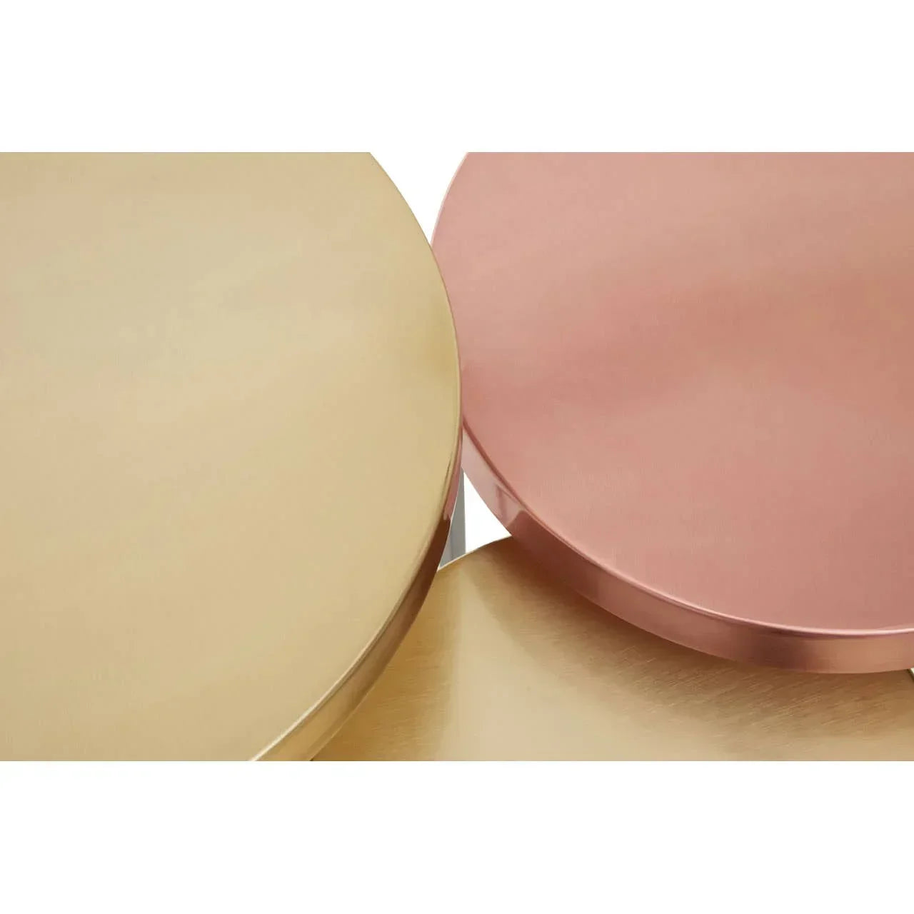 Close-up of gold and rose metallic coffee table tops with smooth finish