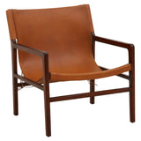 Brown leather accent chair with dark wood frame and armrests, side angle view
