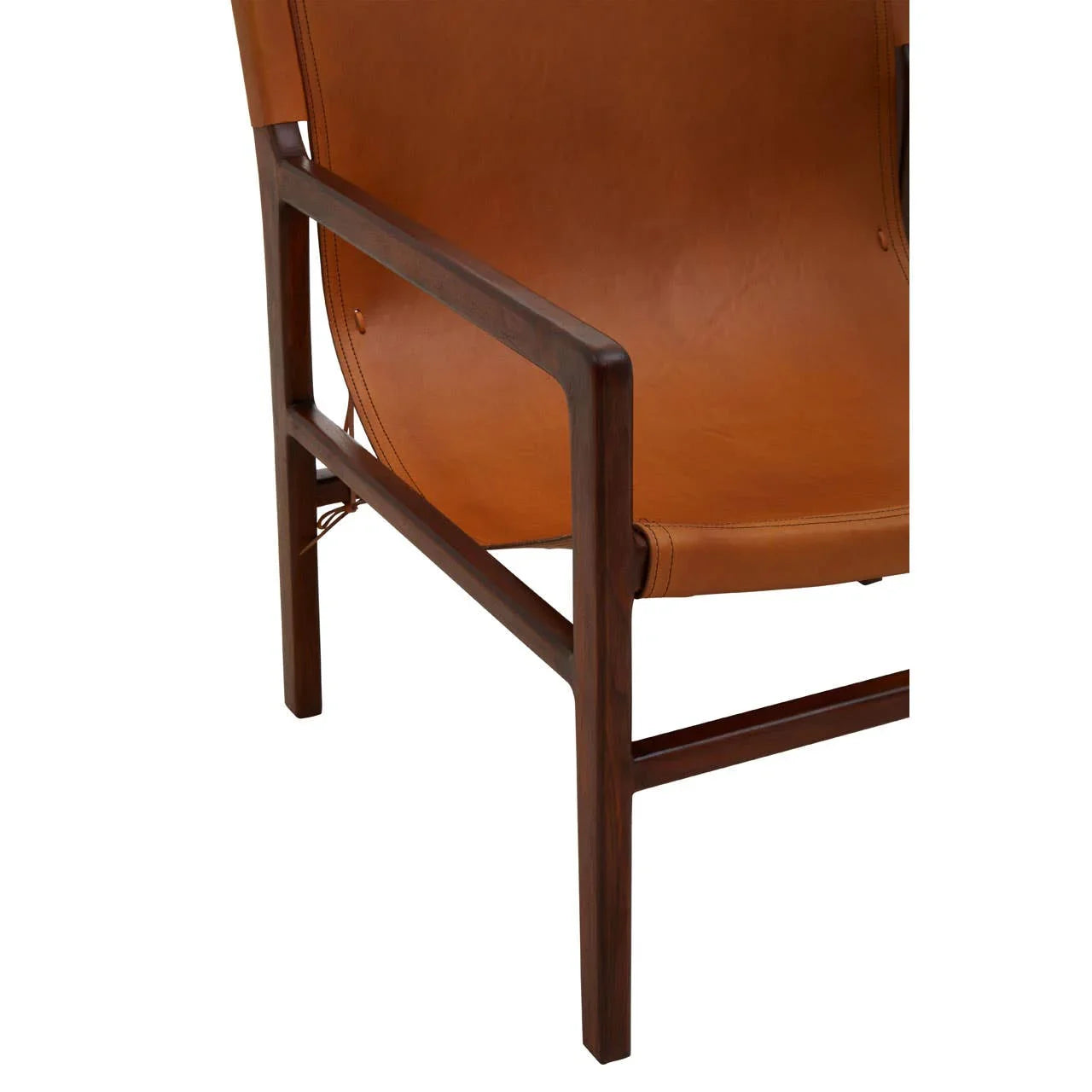 Close-up of tan leather armchair with dark wood frame and stitched seat detail