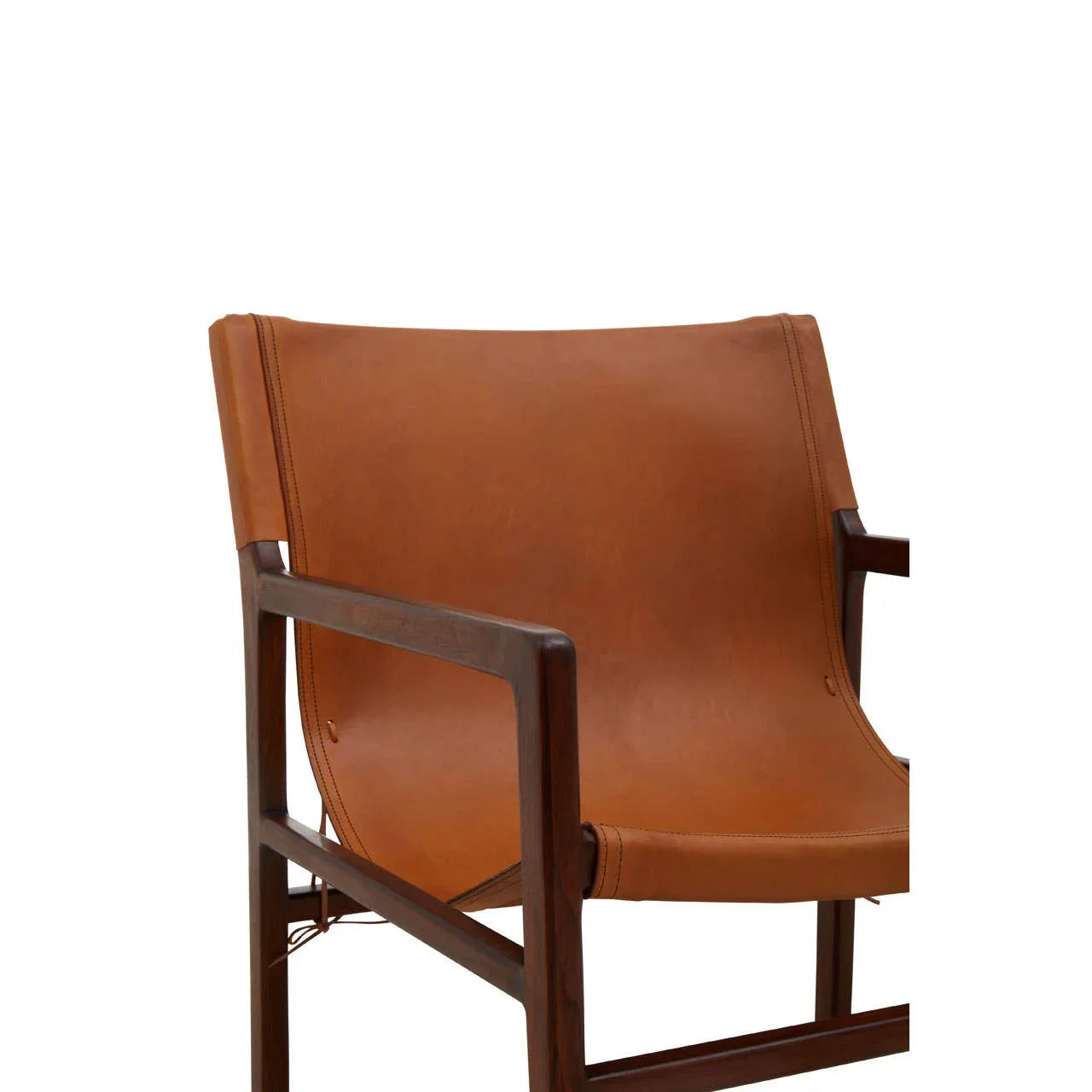 Sling accent chair with tan leather seat and dark wooden frame, angled side view