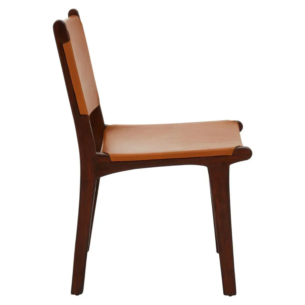 Side profile of wooden dining chair with tan leather seat and backrest
