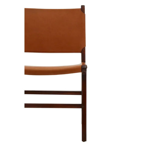 Tan leather dining chair with dark wood frame, partial side view