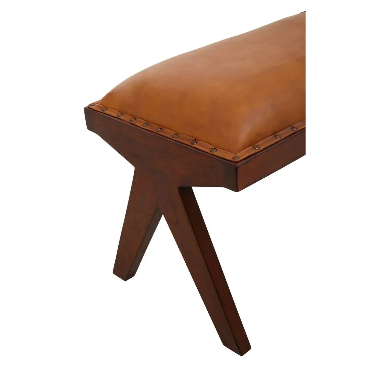 Tan leather bench seat with dark wood legs and nailhead trim, angled side view