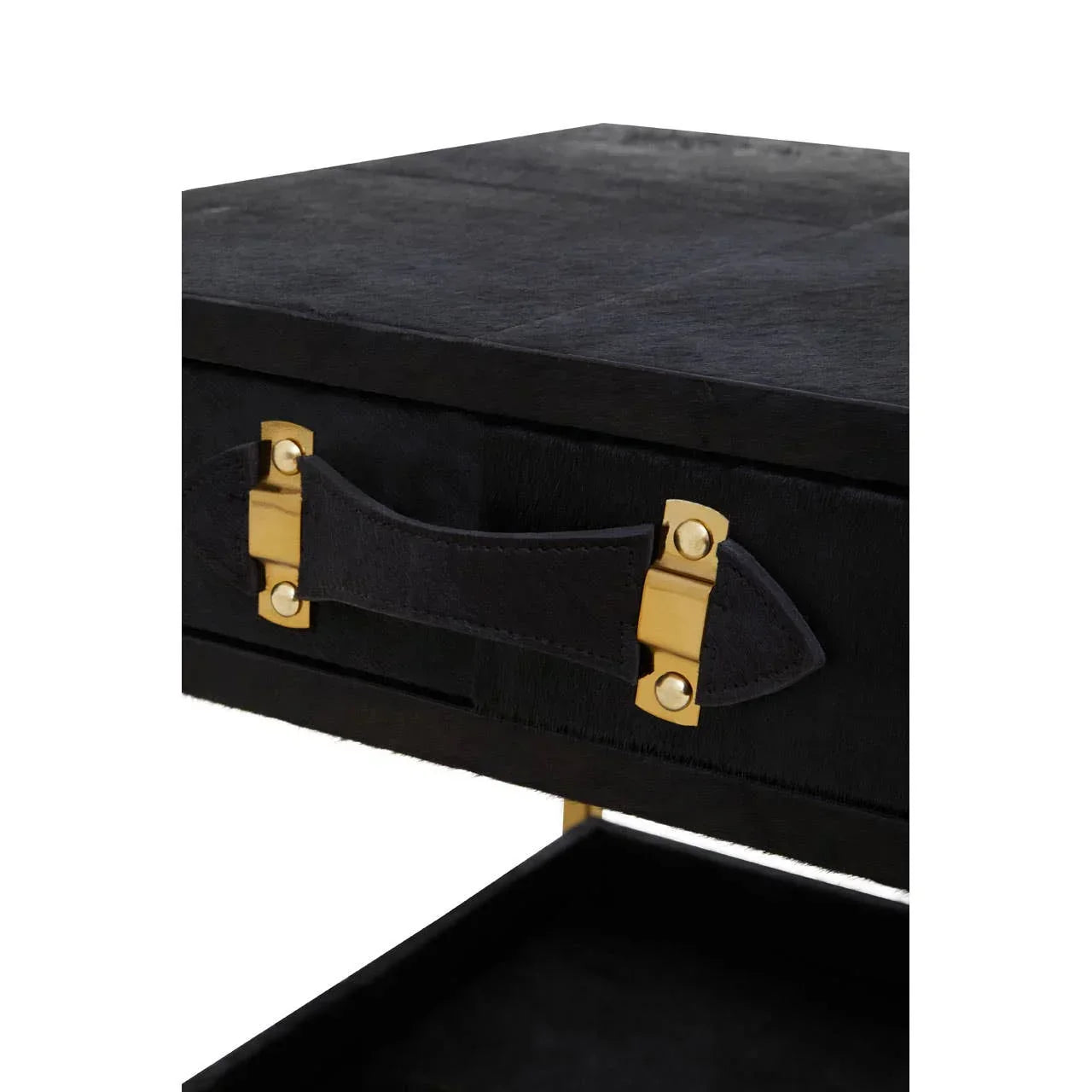 Black side table drawer with gold hardware and leather handle, close-up view