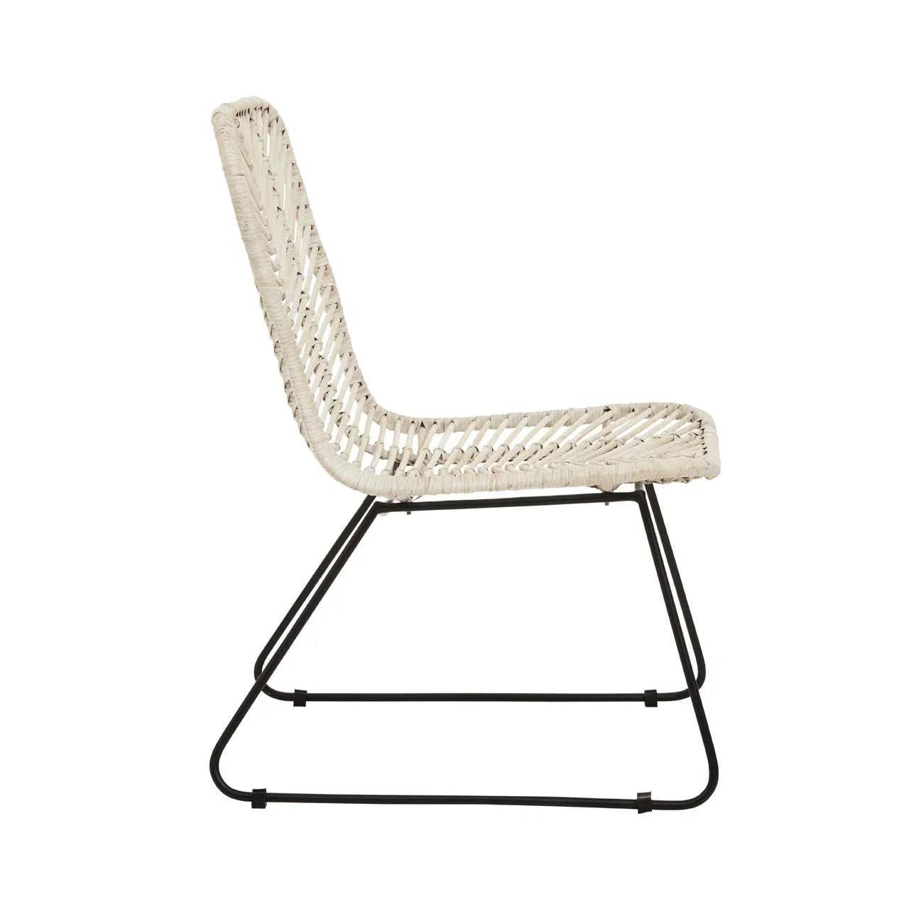 White rattan accent chair with black metal frame, side profile view