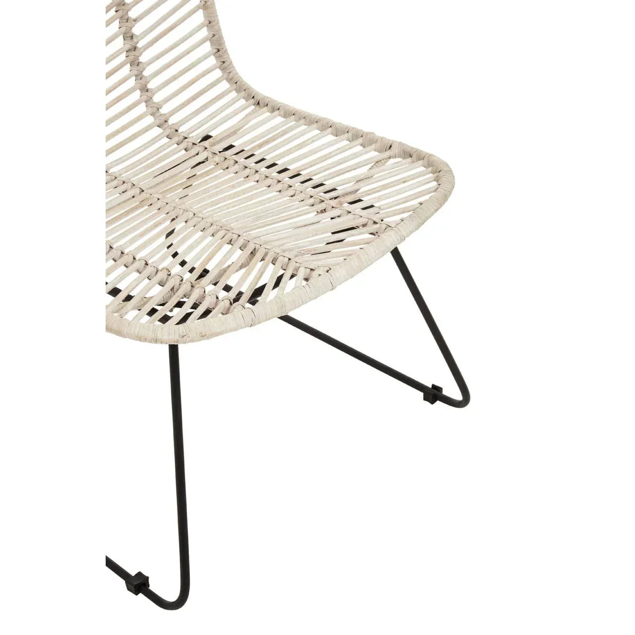 Closeup of rattan lounge chair with cream woven seat and black metal legs