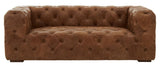 Three-seat sofa upholstered in rich brown leather with a modern Chesterfield design, featuring deep button tufting and wide, square arms. The sofa rests on short wooden legs, showcasing a sleek and contemporary silhouette