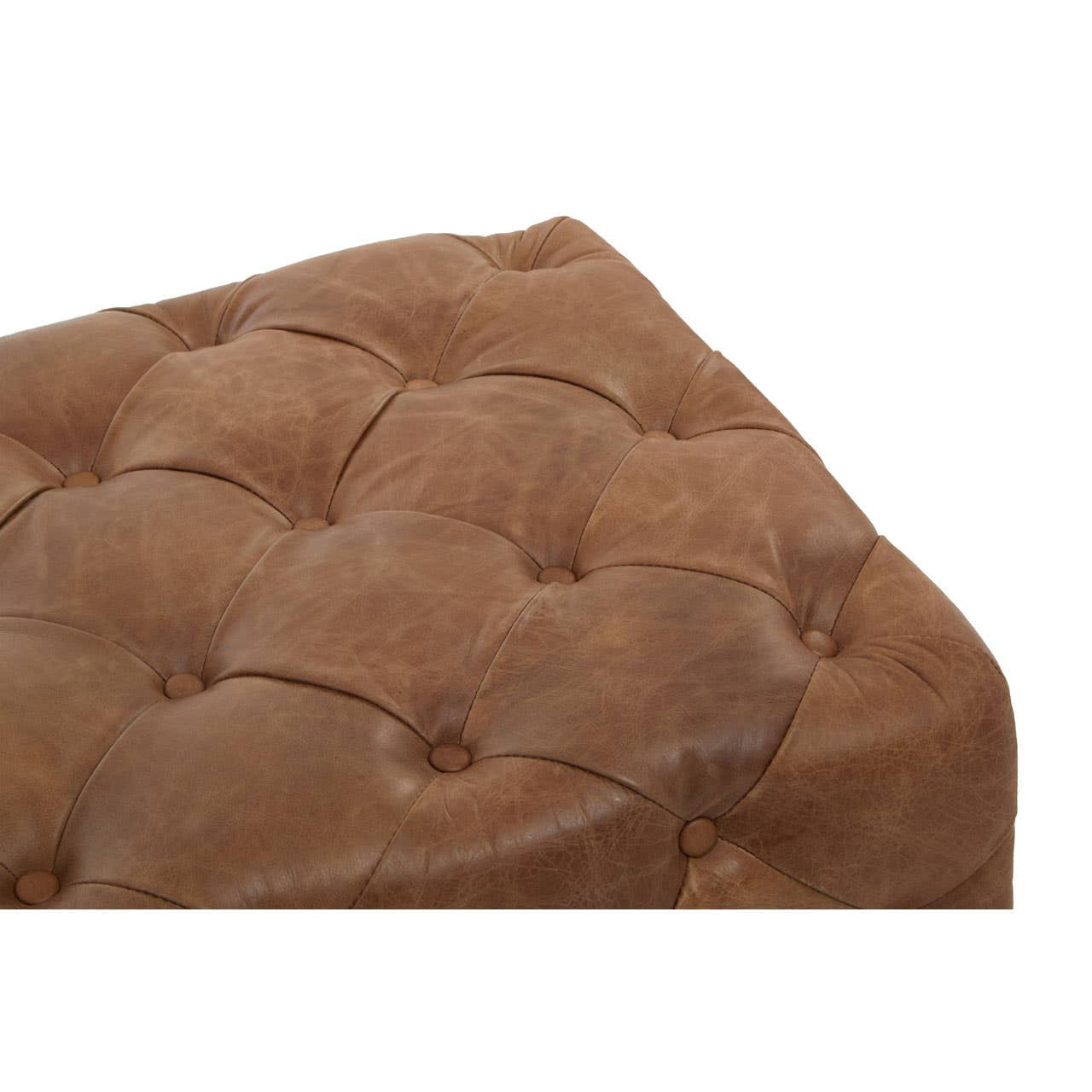 Brown leather rectangle Chesterfield ottoman featuring a tufted design with visible buttons, showcasing a soft and textured surface. The ottoman has rounded edges and a sturdy, plush appearance, suitable for use as a footrest or additional seating