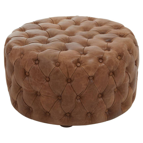 Round brown leather ottoman with deep button tufting and smooth finish