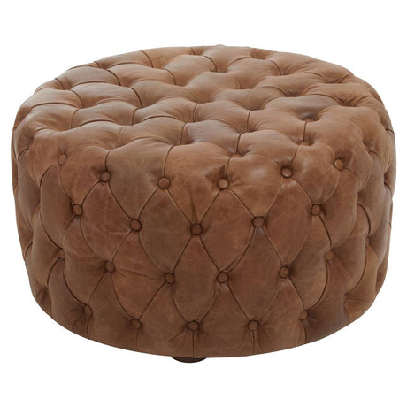 Round brown leather ottoman with deep button tufting and smooth finish