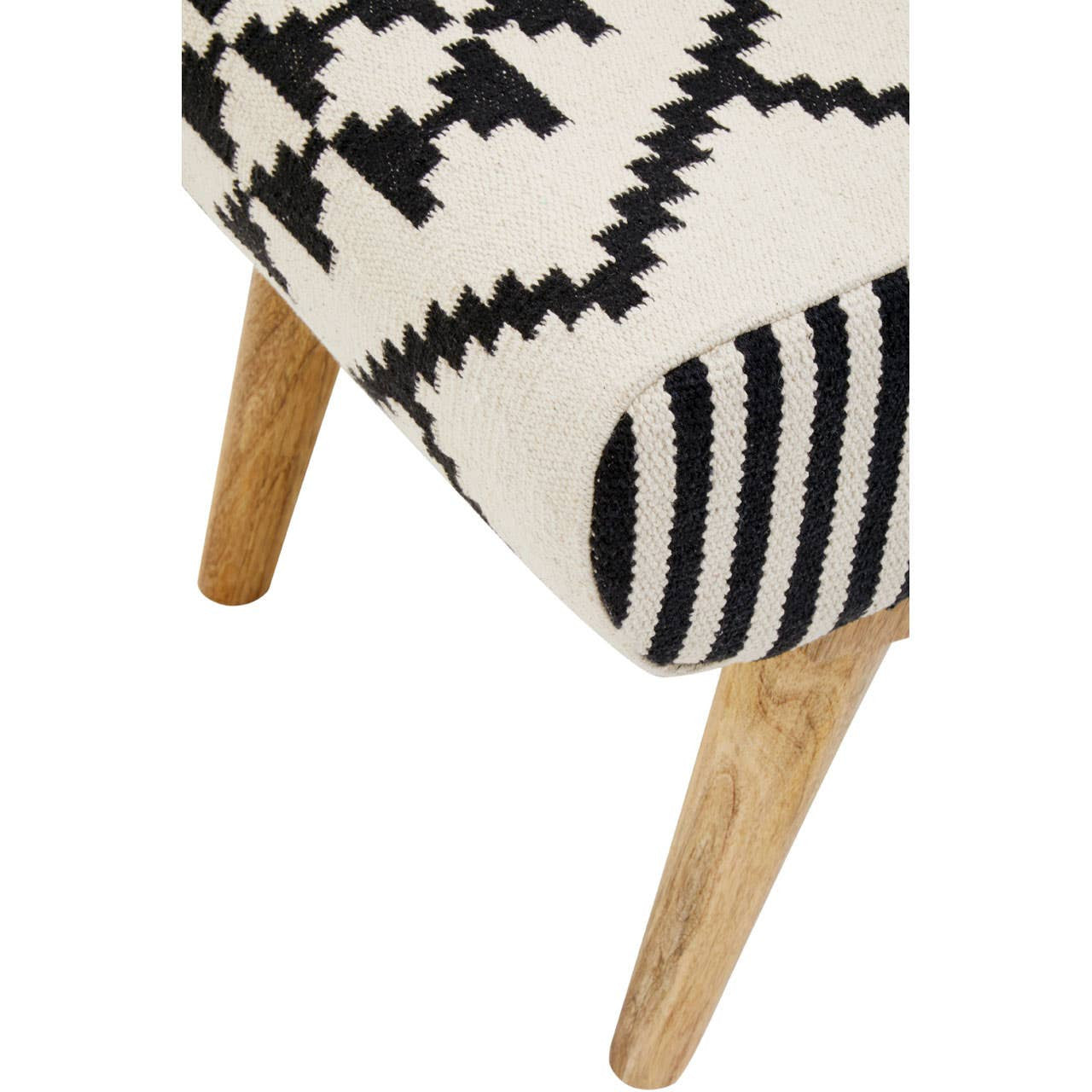 A close-up view of the Cefena Berber Style Footstool featuring a patterned fabric in cream with black geometric designs, complemented by natural wooden legs. The footstool showcases a mix of textures with a striped detail on one side