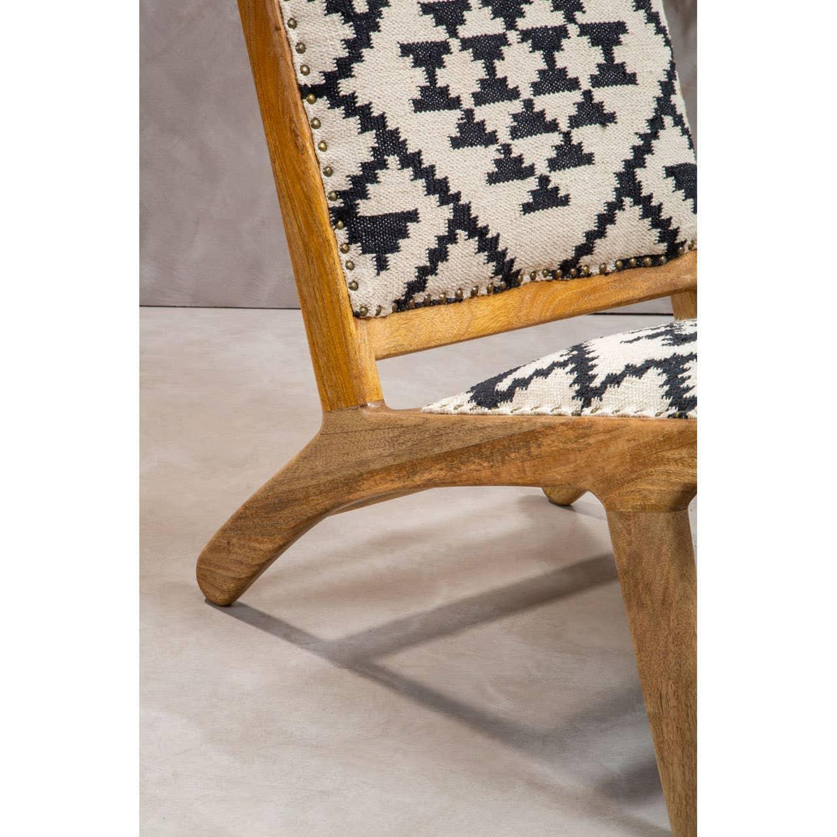 Wooden accent chair with black and white geometric fabric upholstery