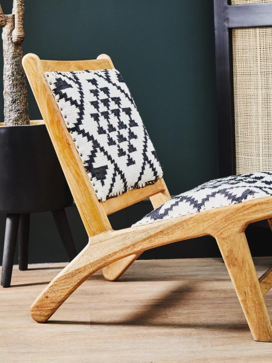 Wooden accent chair with geometric black and white fabric on seat and backrest