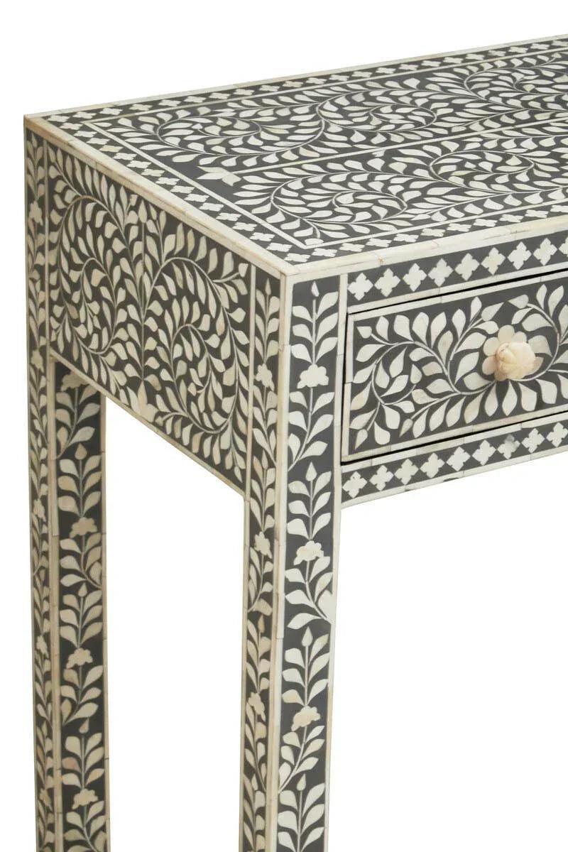 Black and white inlay console table with floral motif and single drawer detail
