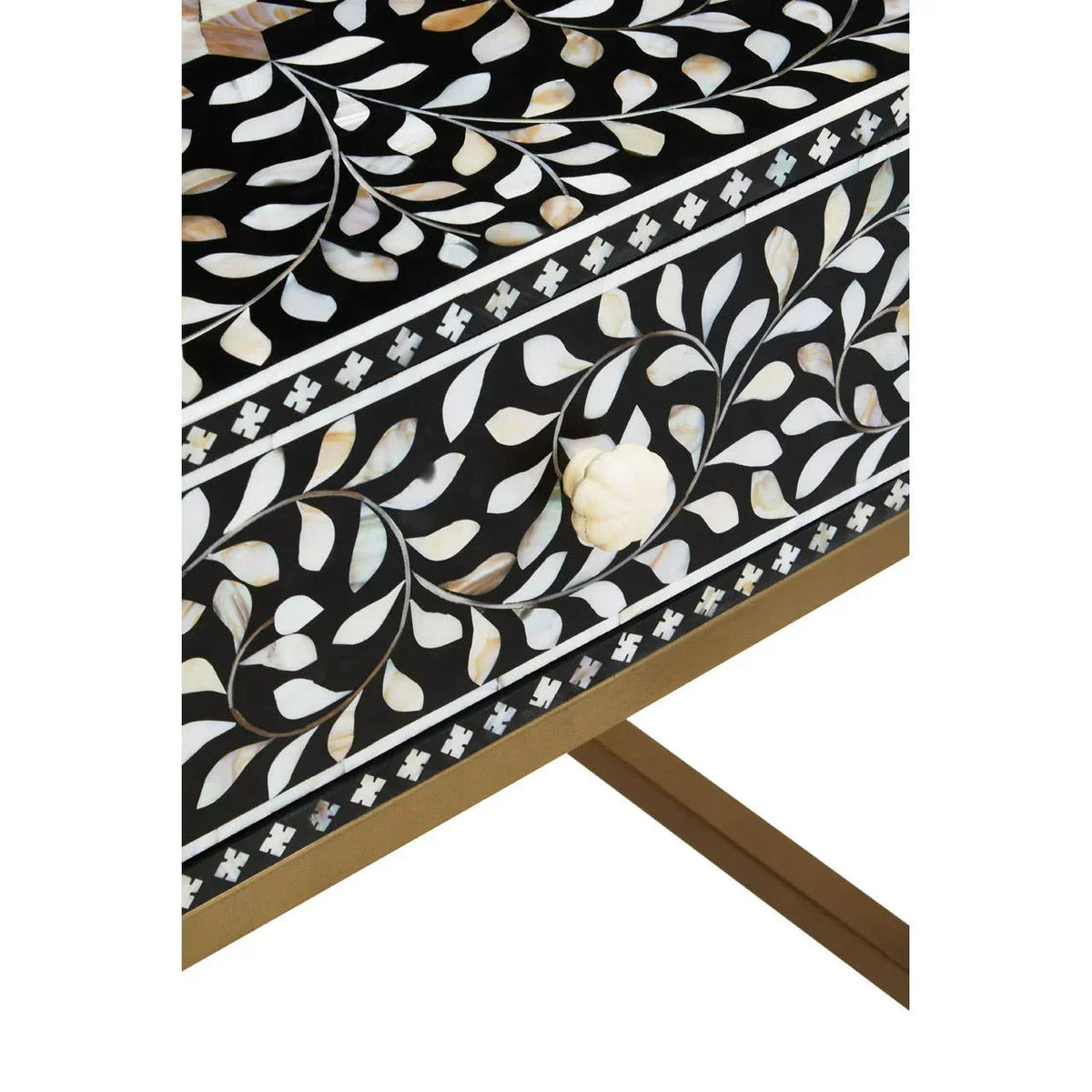 Black bone inlay furniture with intricate floral pattern and shell drawer handle close-up