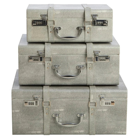 Set of three grey storage trunks with silver handles and combination locks, stacked front view