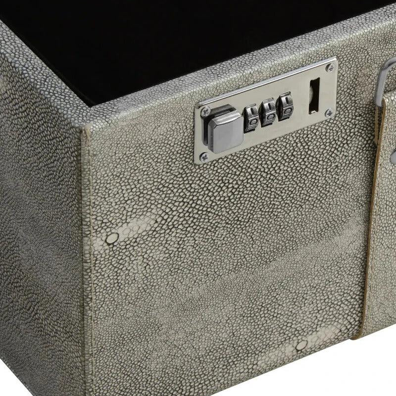 Textured grey storage trunk with silver combination lock and metal hardware close-up
