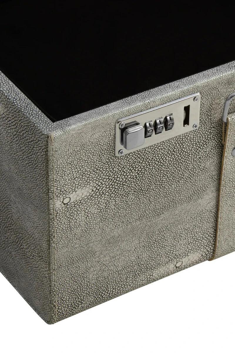 Textured grey storage trunk with silver combination lock and metal hardware close-up