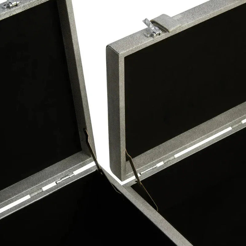 Open grey storage trunk set with textured finish showing interior compartments