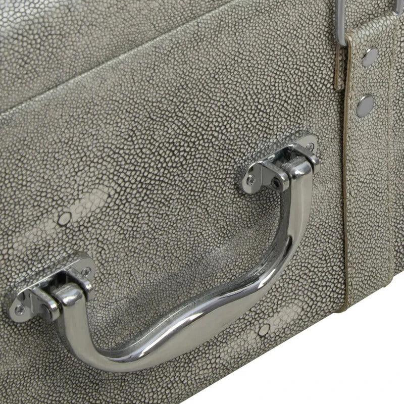 Textured storage trunk close-up with metal handle and faux shagreen finish
